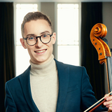 David Liam Roberts holding a cello.